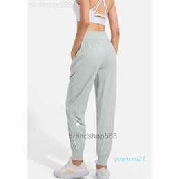 LL femmes Jogging Yoga neuvième pantalon poche Fitness Leggings doux taille haute hanche ascenseur élastique décontracté cordon jambes SH6