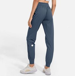LL femmes Jogging Yoga neuvième pantalon poche Fitness doux taille haute hanche ascenseur élastique pantalons décontractés 2024 cordon jambes pantalons de survêtement