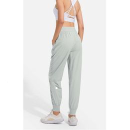 Ll femmes jogging yoga neuvième pantalon de poche leggings de fitness soft hauteur hanche hanche pantalon décontracté élastique