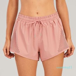 LL Mujeres Pantalones cortos de yoga Trajes Ropa deportiva de cintura alta Ejercicio con bolsillos Usar pantalones cortos Niñas Correr Elástico Prevenir Armario Culotte Doble cubierta SH