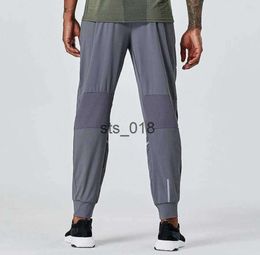 LL Yoga Outfit Pantalons longs de jogging pour hommes Sport en plein air pour la course Yogo Gym poches pantalons de survêtement pantalons hommes décontracté taille élastique fitness T299