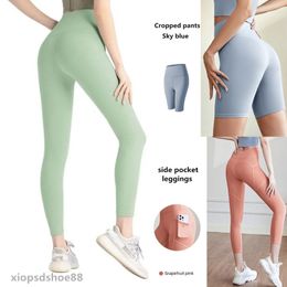 2024 Pantalones de yoga alineando Leggings Mujeres pantalones cortos de pantalones recortados