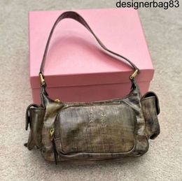 Locomotive peau de vache vintage poche Miui sac de créateur sacs à bandoulière pour femmes multifonction hobo aisselles Y2k célébrité Internet sacs à main fille chaude