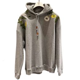 Loewee Sudadera con capucha Diseñador Moda Sudaderas para hombres Otoño Nuevo producto Industria pesada Bordado Patrón de flores de diente de león Casual Suelto con capucha Tendencia de amor