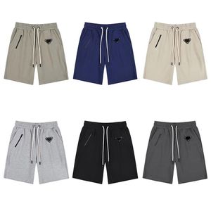 Lâche Hommes Shorts Couleur Unie Pantalon De Survêtement Couples Occasionnels Pantalons De Jogging High Street Shorts Homme triangle métal Court Femmes Hip Hop S1787