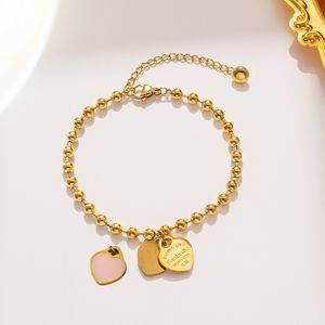 Pendentif en émail d'amour en acier titane plaqué bracelet en or 18 carats bijoux pour femmes perles en gros conception de niche bijoux pour femmes en forme de coeur 2024