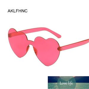 Amor corazón forma gafas de sol mujeres sin llanta tinte claro lente colorido sol gafas hembra rojo rosa amarillo sombras de viaje precio experto diseño de calidad