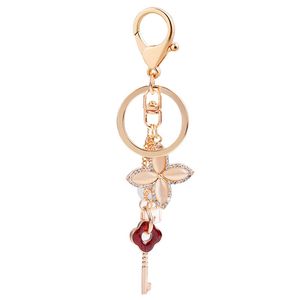 Liefdeslot sleutelhanger ring houder opaal vier blad klaver bloem auto sleutelheren vrouwen heren sieraden tas hangers charms mode paren strass sleutelhangers accessoires