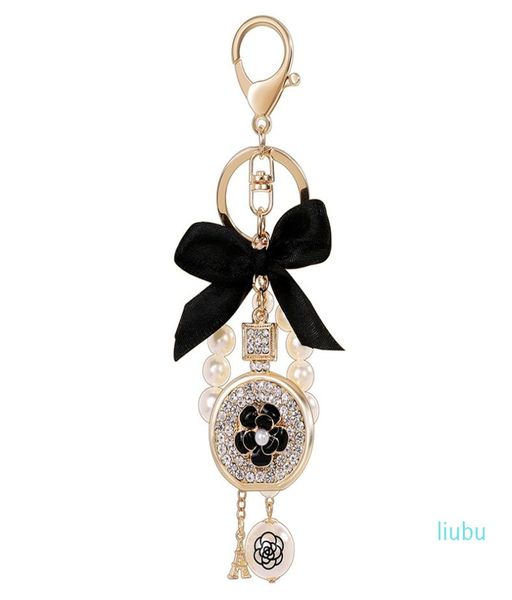 Encantador llavero del perfume de perfume de flor de la perla de la boquía de nuevo diseñador de lujo de lujo Diamond Rhinestone Bag Charm1919645