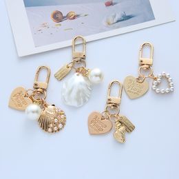 Joli mignon perle coquille conque porte-clés femmes en alliage de Zinc amour porte-clés pendentif voiture porte-clés sac à dos porte-clés dame mode bijoux accessoires cadeau