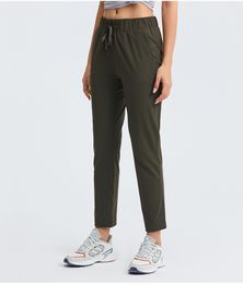 LU LU LEMONS Tissu L154 Pantalons de tenue de yoga élastiques avec deux poches latérales pour femmes, jogging d'entraînement, collants de sport de plein air, pantalons de survêtement de course