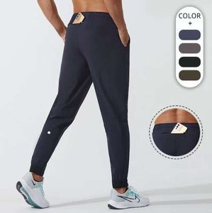 LU Pantalones de yoga hombres mujeres LL Jogger Traje deportivo largo Cordón de secado rápido Gimnasio Bolsillos Pantalones de chándal Pantalones Casual Cintura elástica fitness