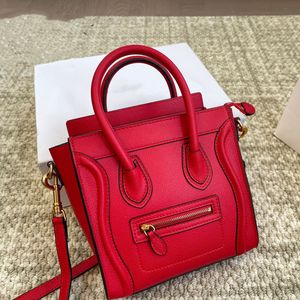 Bagage nano kalfsleer kaviaar ontwerper schouder crossbody tas glimlachende gezicht tas tas triompres rits rits rits grote capaciteit klassieke hobo klassieke handtassen rood