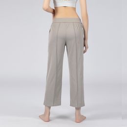 LL Pantalones deportivos Diseñador Mujeres sueltas Pantalones de yoga para correr Bolsillo Cintura elástica Fiess Push Uptrousers Pantalones de gimnasio Pantalones de entrenamiento deportivo para mujer