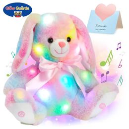 Les jouets en peluche de lapin en coton lumineux jettent des lumières LED mignons musics arc-en-ciel en peluche cadeau de Pâques Gift pour les enfants filles 240416