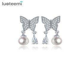 Luoteemi Nieuwe hoogwaardige vrouwen Mooie dames Imitatie Pearl vlinderontwerp Silver Pin Ear Buds oorbellen feestjuwelen2420848