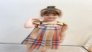 Luxury Baby Girl Princess Dress Kids Grid Doble Bow Summer Manija corta para niños Diseñador casual Wear3188202