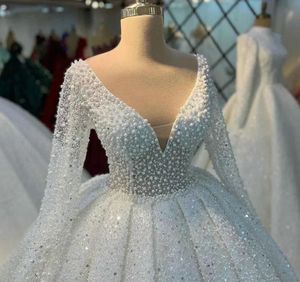 Robe de bal de luxe Robe de mariée à col en V 2024 Arabe Dubaï Tulle Perles Illusion de perles Manches longues Mariée Robes formelles Robe De Noiva