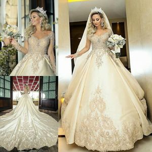 Luxe Beaded Lace Trouwjurken Sheer Jewel Hals Geappliceerd Lange Mouwen Bruidsjurken Een lijn Kathedraal Trein Satijn Robe de Mariée