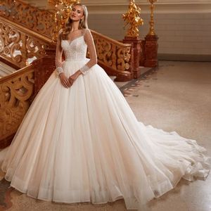 Luxe kralen baljurk trouwjurk voor bruids transparant lange mouwen vestidos de mariage tule prinses bruidsjurken