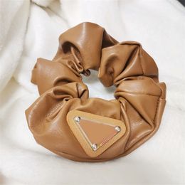 Luxury merkontwerper dames haarbubbels haren Haren Scrunchy Ring Clips Elastische omgekeerde driehoeksontwerpers Sportdans Dans Scunchie Haarband Pony Tails Holder