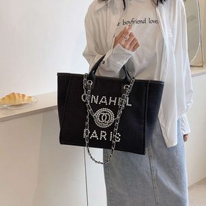 Les sacs de conception de luxe sont bon marché à vendre Beibei Shangpin 2024 Automne/Hiver Nouveau sac de plage en toile à la mode avec perles Handbill of Louche épaule diagonale Straddle fourre-tout pour femmes