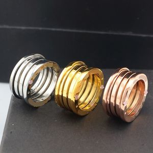 Diseñador de lujo Anillo de resorte de oro de 18 quilates Anillo de moda de oro rosa de plata de acero inoxidable para amantes Anillo de pareja de cerámica negro blanco Para mujer hombre Regalo de joyería