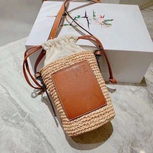 Luxe ontwerper strandtas enkele schouder crossbody tas kleine bucket tas dames nieuwe stro handgeweven draagtas buitenshuis casual grote capaciteit boodschappentas