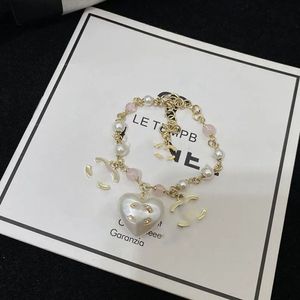 Luxe designer armband hanger Charms armbanden voor vrouwen Pearl love heart armbanden modetrend premium temperament elegante klassieke sieradencadeaus leuk