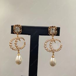 Luxe Designer Fashion Dangle Kroonluchter Dangle Oorbellen 18k goud kristal Witte hars hanger oorbellen Damesfeestsieraden