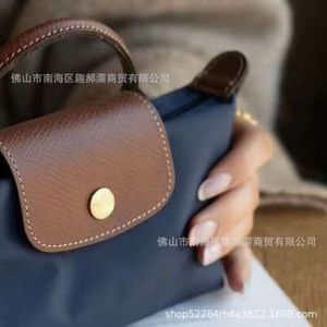 Sacs à main de luxe Mini Jiaozi Longxiang Sac 2024 Nouvelle mode Nylon à poignée unique avec cuir véritable Mini sac à bandoulière non perforé