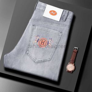Luxe designer jeans voor heren lente/zomer nieuwe product jeans, slanke heren, kleine voeten, high -end trendy merk elastische dunne bedrukte broek modebroek