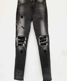 Designer de luxe Jeans pour hommes Pantalons longs Genou maigre Fermeture à glissière grise Cuir de sort Détruire le jean de mode trou de couette Hommes Designers Chiffons