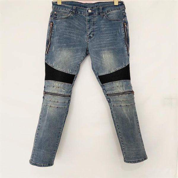 Designer de luxe Jeans pour hommes Pantalons longs Fermeture à glissière maigre Genou noir bleu Cuir Spell Détruire la courtepointe Trou déchiré jean de mode Hommes D1930