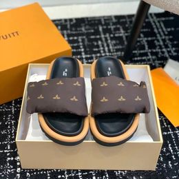 2023 nieuwe luxe slipper designer vrouw ZWEMBAD KUSSEN COMFORT man schoen Sandalen Zonsondergang Platte glijbaan Comfort Muilezels Gevoerde riem aan de voorkant Modieuze platte