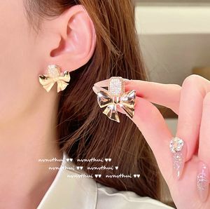 Designer de luxe brillant éclat géométrique noeud gemme boucles d'oreilles concepteur plaqué or 18 carats papillon gland Zircon boucle d'oreille clip