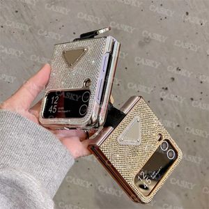Designer de luxe Samsung Flash Diamond Phone Case Galaxy Z Flip3 4 W23 Flip Cases Mode Couple Noir Or Argent Couvertures de téléphone portable