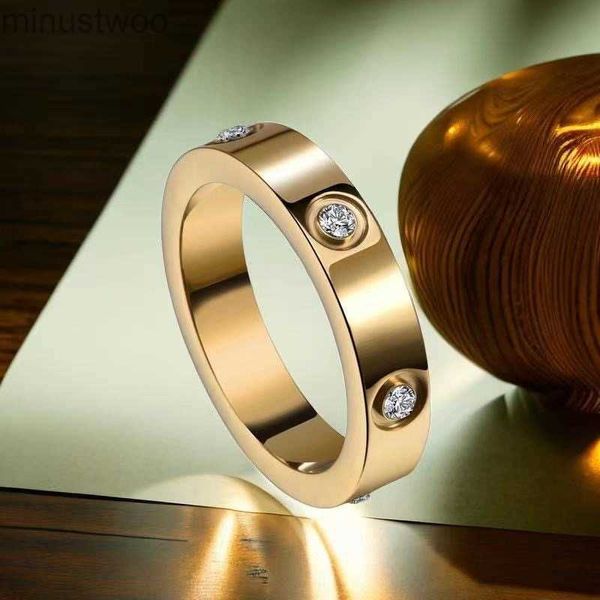 Diseñador de lujo Anillo de amor de oro rosa de acero de titanio para mujeres Anillos de compromiso de circonio Hombres Joyería Regalos Accesorios de moda con caja OXOK