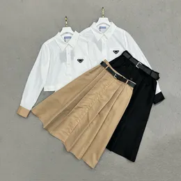 Conjunto de vestido de dos piezas de diseñador de lujo para mujer, moda de otoño, solapa de manga larga, parte superior con una botonadura y falda larga elegante de corte a