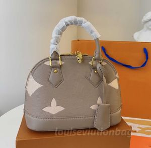 Designer de luxe Femmes Luxurys Designers Sacs ronds de haute qualité en cuir véritable pochette croissant sacs à main