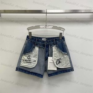 Luxe ontwerper dames jeans 2024 zomer nieuwe zoete cool gepersonaliseerd modieus contrast geborduurde zak omgedraaid denim shorts