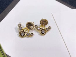 Concepteur de boucles d'oreilles de luxe pour femmes Diamond-Set Earttud janvier nouveau produit en forme de coeur en forme d'écouteur Gold Silver