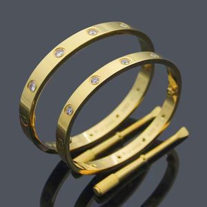 Pareja de moda de lujo Joyas de amor Pulseras de brazalete de cristal para mujeres / Hombres Pulseras de acero inoxidable de color dorado Brazaletes Bijoux Regalo con bolsa de polvo gratis