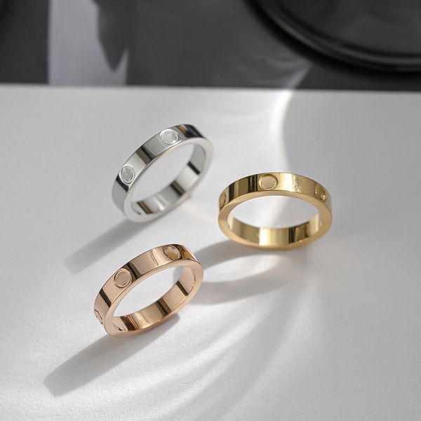 Bagues de couple de créateurs de mode de luxe, pierres de diamant à vis, bagues baguette en acier titane, trois couleurs disponibles, cadeaux de mariage pour hommes et femmes, incolore