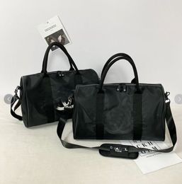 Luxe mode mannen vrouwen reizen plunjezakken merk designer bagage handtassen grote capaciteit sport plunjezak 45-25-21cm