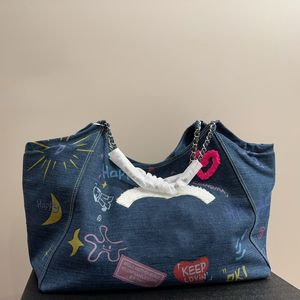 Bolso de mano de diseñador de gran capacidad de mezclilla con grafiti de lujo, bolso de hombro de marca francesa a la moda para mujer, bolso de alta calidad con doble letra y bolsas de compras, bolso para axila