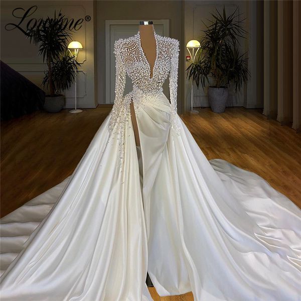 Abiti da sposa di lusso con perle di perline pesanti Abiti da sposa con illusione a sirena 2020 con abito da sposa musulmano Dubai Couture lungo treno