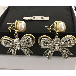 Luxury Mui Mui Orear Bringle Designer Brouille à oreilles pour femme coeur oreille de coeur Miao Familles New Big Bow Pearl Ear Stud Clip pour les femmes avec un luxe et Colorfu légers de haut niveau