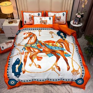 Ensembles de literie design orange de luxe soie cheval imprimé reine taille housse de couette drap de lit mode taies d'oreiller couette ensemble