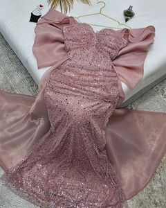 Vestidos de fiesta de lujo de color rosa con tren de lazo grande fuera del hombro Vestidos de fiesta formales de noche de lentejuelas de sirena Arabia Saudita Robe De Soriee Vestidos De fiesta